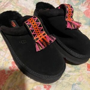 UGG Kids Black Slippers with Pink and Orange Accents